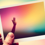 A hand reaching out to touch a polaroid photo of a blurry, fleeting moment.